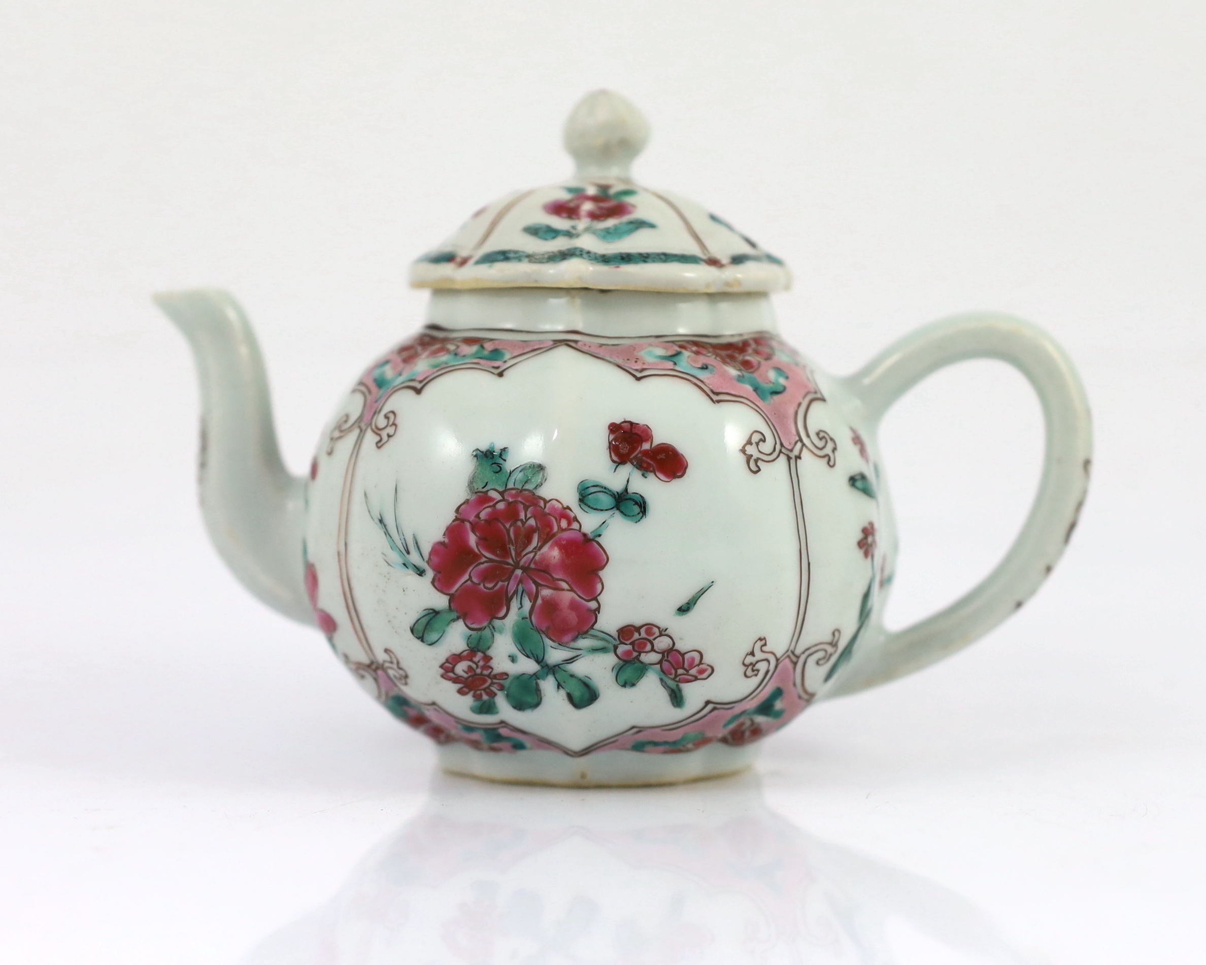 A Chinese famille rose petal lobed teapot, Yongzheng period, minor faults